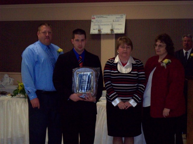 Firefighter of the Year Keith Hemming with Chief Craig, Assistant Chief Raley, and Mary Belle Combs.